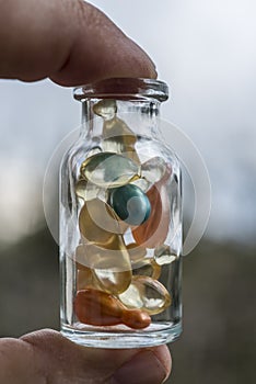 Gel capsules in a glass bottle