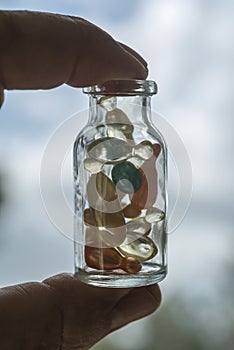 Gel capsules in a glass bottle