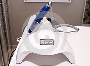 gel polish remover and manicure dryer on a table