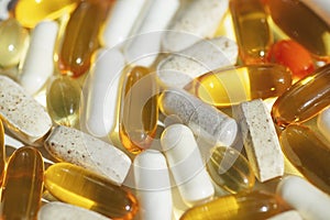 Gelatin capsule, colorful pills and tablets close up in soft focus. Medical supplement.