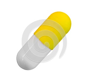 a gelatin capsule with yellow cap isolated on white background