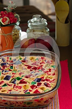 Gelatin in colors, sweet very famous in Brazil. Brazilian candy on the wood table kitchen