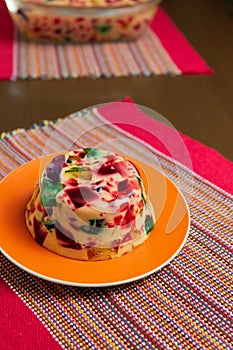 Gelatin in colors, sweet very famous in Brazil. Brazilian candy on the wood table kitchen