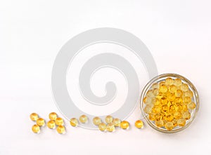 Gelatinous capsules of the fish oil isolated on a white background. Dietary supplement for disease prevention