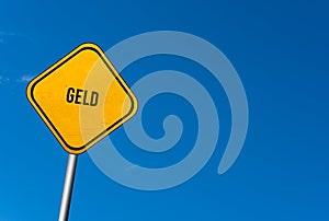 geld - yellow sign with blue sky