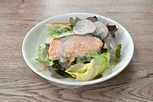 gelled salmon with mixed vegetable salad dressing spicy and sour seafood cream sauce on plate