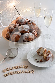 Gelukkig Nieuwjaar (translation: Happy New Year) written and a bowl of traditional oliebollen (Dutch dough