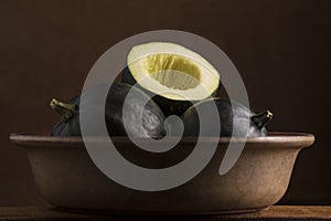 Gem squash placed in a brown bowl