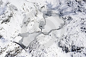 Gemelli lakes with snow and ice, Orobie, Italy