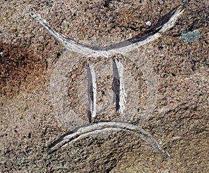 gemini zodiac sign curved in stone