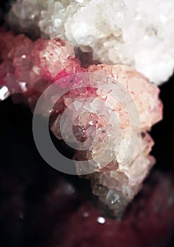 Gemstone closeup as a part of cluster filled with rock crystals.