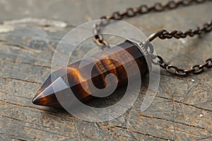 gemstone jewelry, elegant tiger eye stone pendant on a dainty chain, beautiful and protective jewelry piece that photo