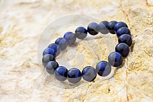 Gemstone known as tiger eye or cat eye with a blue color contrasted with blue. , Blue Color Tigers Eye Stone