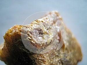 Gemstone macro photo. A stone with grains of gold. Geology and Mineralogy. photo