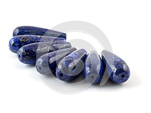 Gemstone natural lapis lazuli on white background, beads