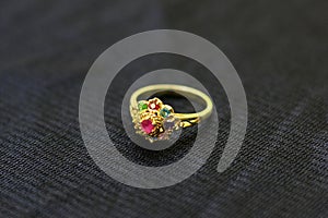 A gemstone ring is a beautiful jewelry on a black cloth