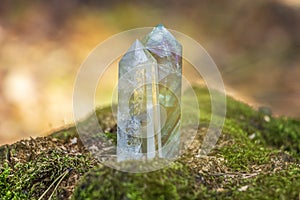 Gemstones fluorite, quartz crystal. Magic rock for mystic ritual, witchcraft Wiccan and spiritual practice on stump in forest. photo