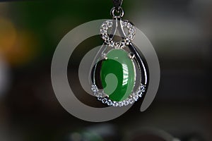 Gemstones jewelery Is a white gold pendant necklace. Set with diamonds and Green jade, rare,