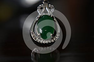 Gemstones jewelery Is a white gold pendant necklace. Set with diamonds and Green jade, rare,