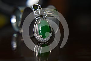 Gemstones jewelery Is a white gold pendant necklace. Set with diamonds and Green jade, rare,