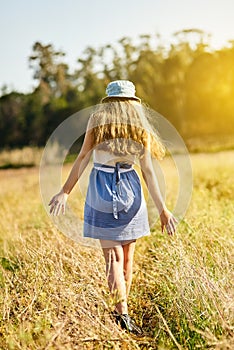 Gen z, girl and walking in nature for freedom, travel and adventure in countryside for spring. Woman, journey and