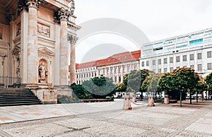 Gendarmenmarkt Square in Berlin with church and trees.