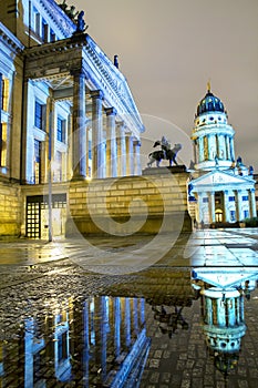 Gendarmenmarkt square illuminated during sunset in Berlin city center, Germany