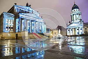 Gendarmenmarkt square illuminated during sunset in Berlin city center, Germany