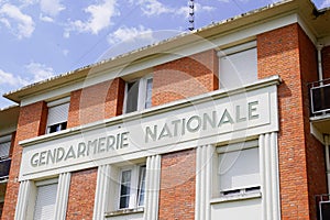 Gendarmerie nationale is french military police with text sign logo in building office photo