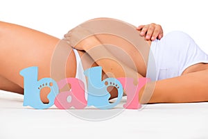 Gender of child: boy, girl or twins? Concept of pregnancy. Pregnant woman