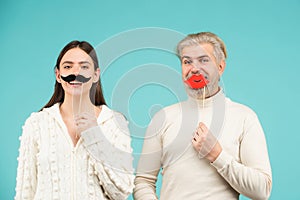Gender concept. Couple of woman with moustache and man with red lips. Gender equality. Transgender gender identity