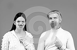 Gender concept. Identity transgender, gender stereotypes. Couple of woman with moustache and man with red lips. Gender