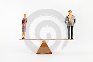 Gender equality concept. Male and female on the scales with balance