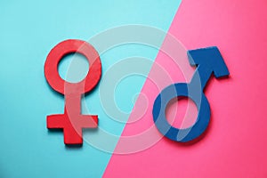 Gender equality. Male and female symbols on color background, flat lay