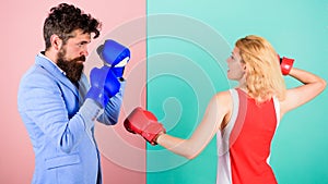 Gender equality. Man formal suit and athletic woman boxing fight. Couple in love competing in boxing. Female and male