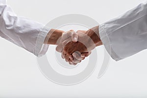 Gender-inclusive handshake signifies equality in healthcare photo