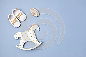 Gender neutral baby shoes, rocking horse and teether