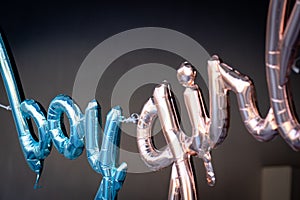 Gender reveal metallic balloon ideas for boy and girl sign