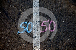 Gender symbol on asphalt, gender concept