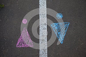 Gender symbol on asphalt, gender concept