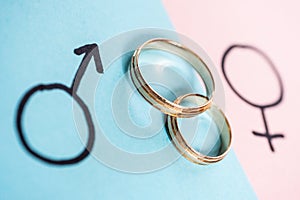 Gender symbols Venus and Mars indicate man and woman with wedding rings. Heterosexual marriage