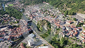 General aerial view of small French town of Tarascon-sur-Ariege in valley of Pyrenees on banks of Ariege river on summer