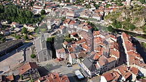 General aerial view of small French town of Tarascon-sur-Ariege in valley of Pyrenees on banks of Ariege river on summer