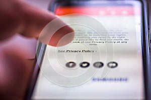 General Data Protection Regulation - GDPR - closeup human finger pointing to smartphone message link See Policy Policy