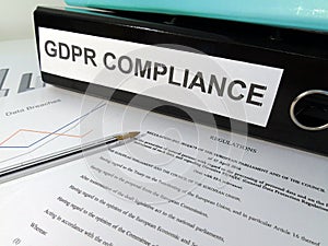 General Data Protection Regulation GDPR Compliance Lever Arch Folder on Cluttered Desk