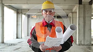 General foreman with building drawings at project site