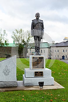 General Georges-Philias Vanier statue and RÃ©giment canadien-franÃ§ais in fleur-de-lys inscription on granite monument