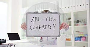 General practitioner asks if you are insured at clinic