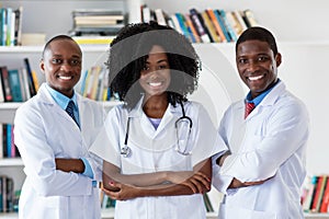 General practitioner and doctor and nurse as african american medical team photo
