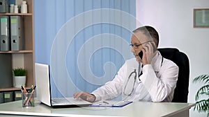 General practitioner giving online and phone consultations, servicing patients